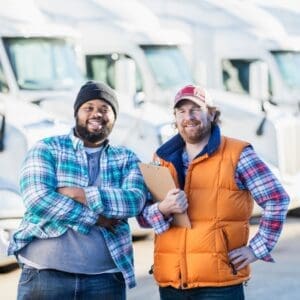 Two truck drivers smiling