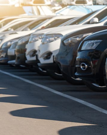 A row of crossover SUVS in a fleet parking lot