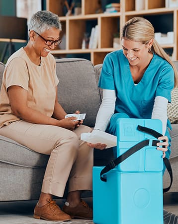 Doctor, senior woman and home with medicine, box or delivery via Pharmaceutical Transport