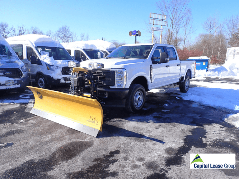 Ford F-250 pickup truck with a Fisher HD2 straight-blade snow plow mounted on the front, delivered by Capital Lease Group