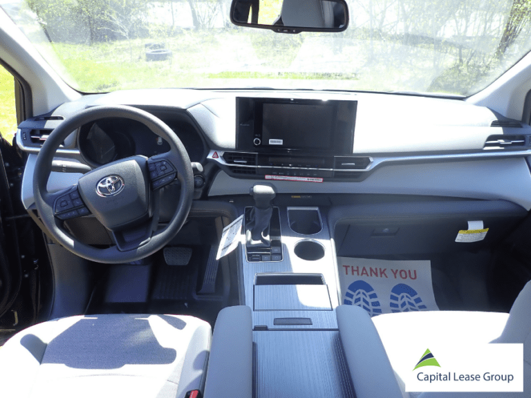 Driver's seat and dashboard of a 2026 Toyota Sienna Hybrid wheelchair van with touchscreen display